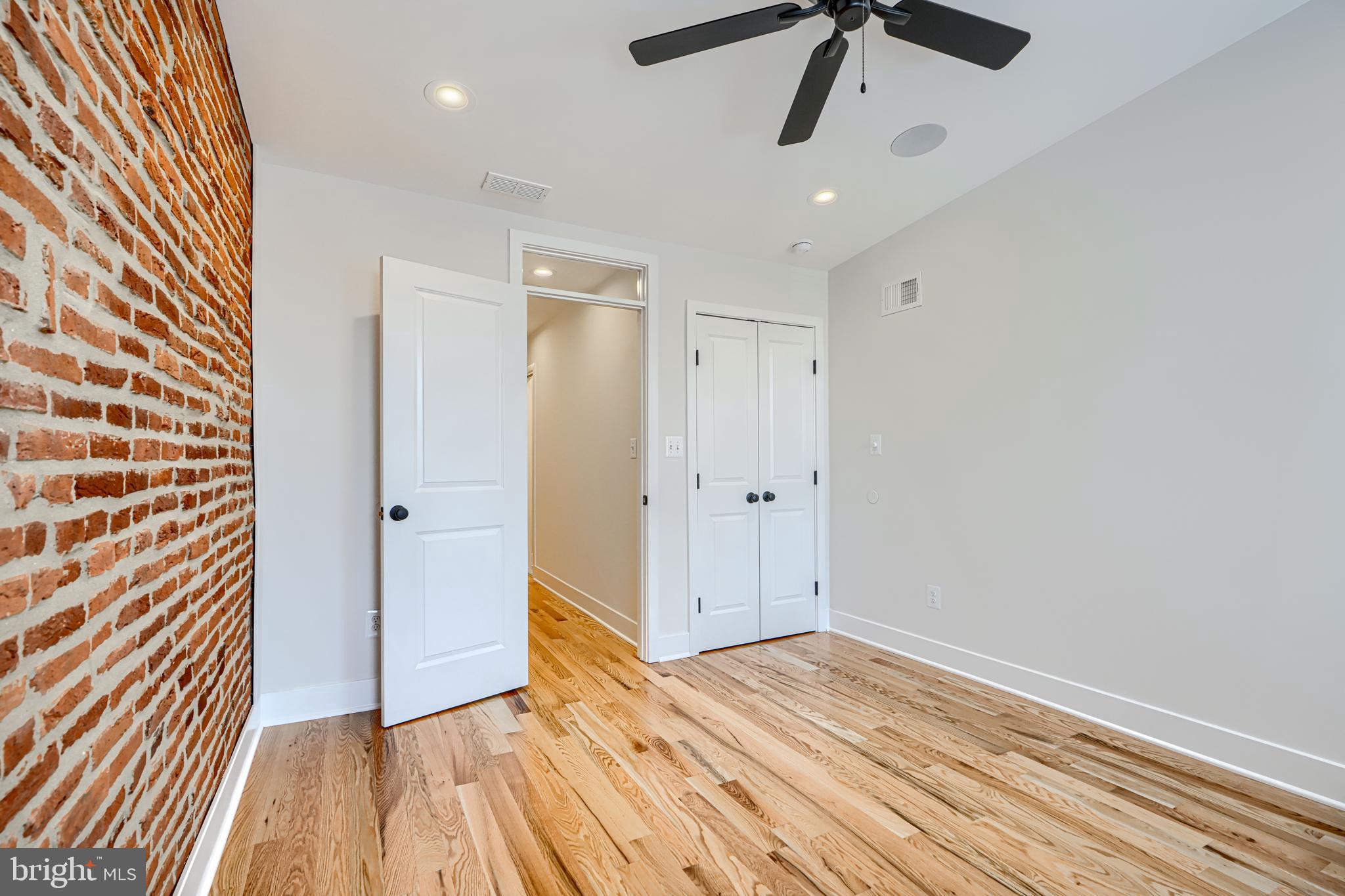 1427 Patapsco Street Baltimore, MD 21230 - Photo 20 of 34 a view of empty room with wooden floor