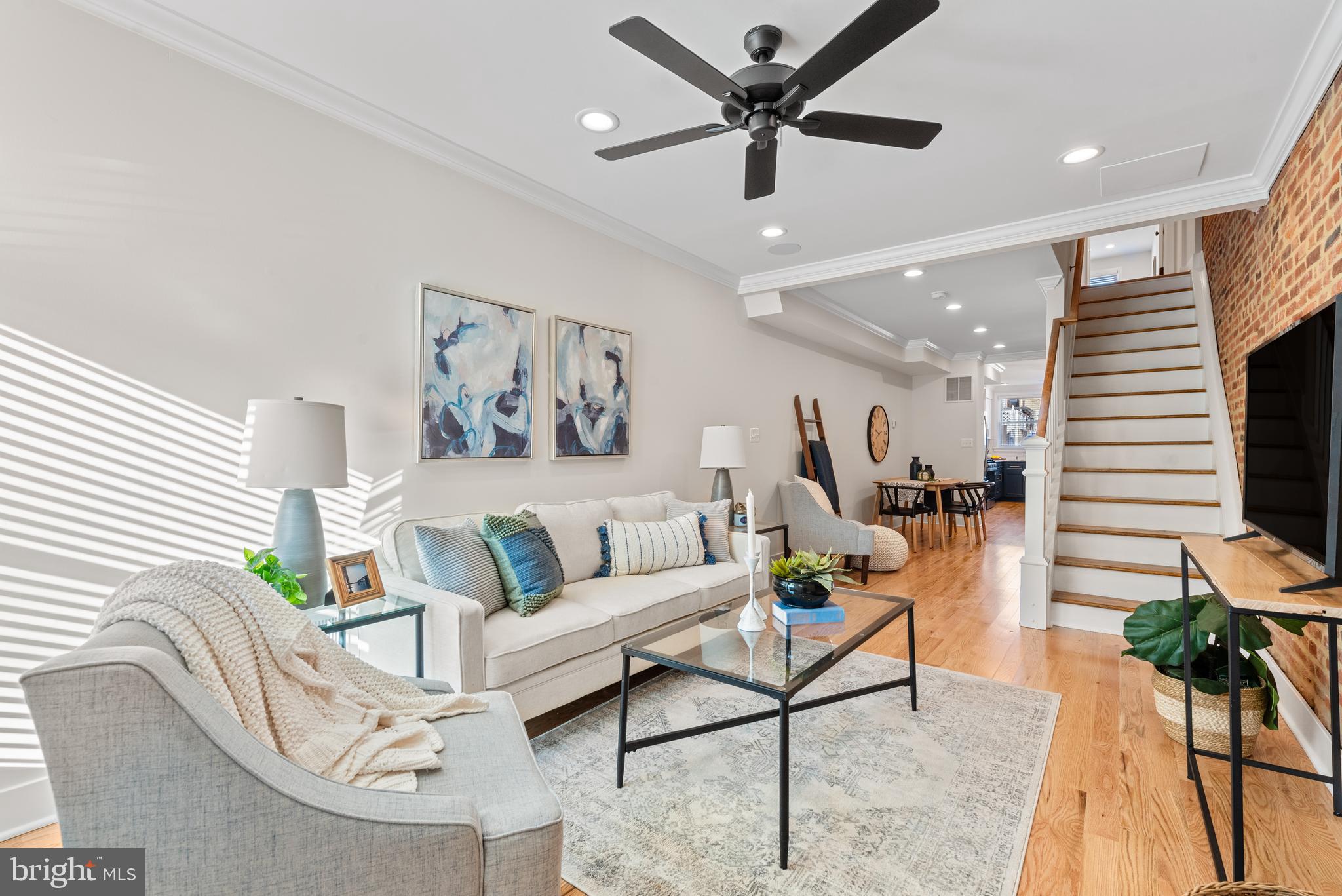 1427 Patapsco Street Baltimore, MD 21230 - Photo 2 of 20 a living room with furniture and a chandelier