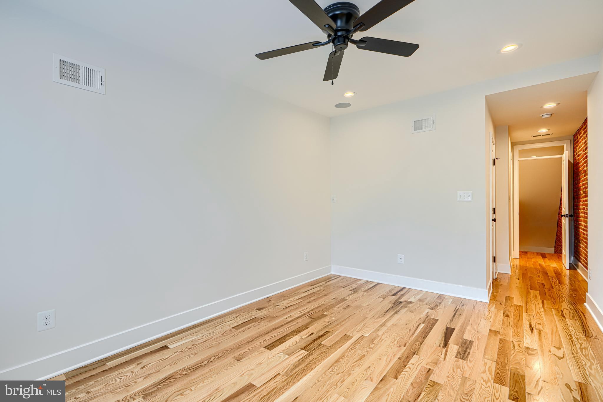 1427 Patapsco Street Baltimore, MD 21230 - Photo 25 of 34 wooden floor in an empty room