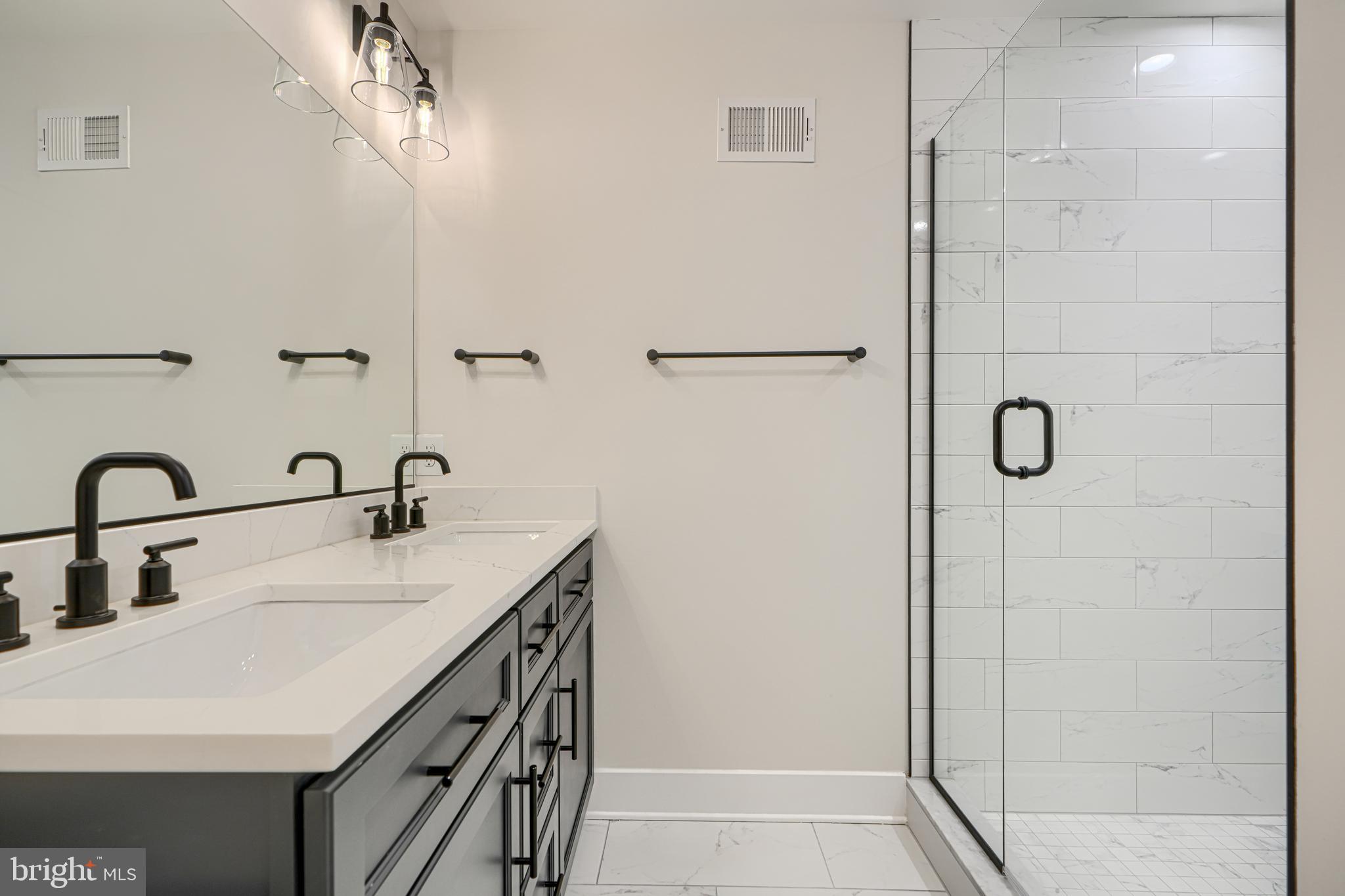 1427 Patapsco Street Baltimore, MD 21230 - Photo 28 of 34 a bathroom with a sink and mirror