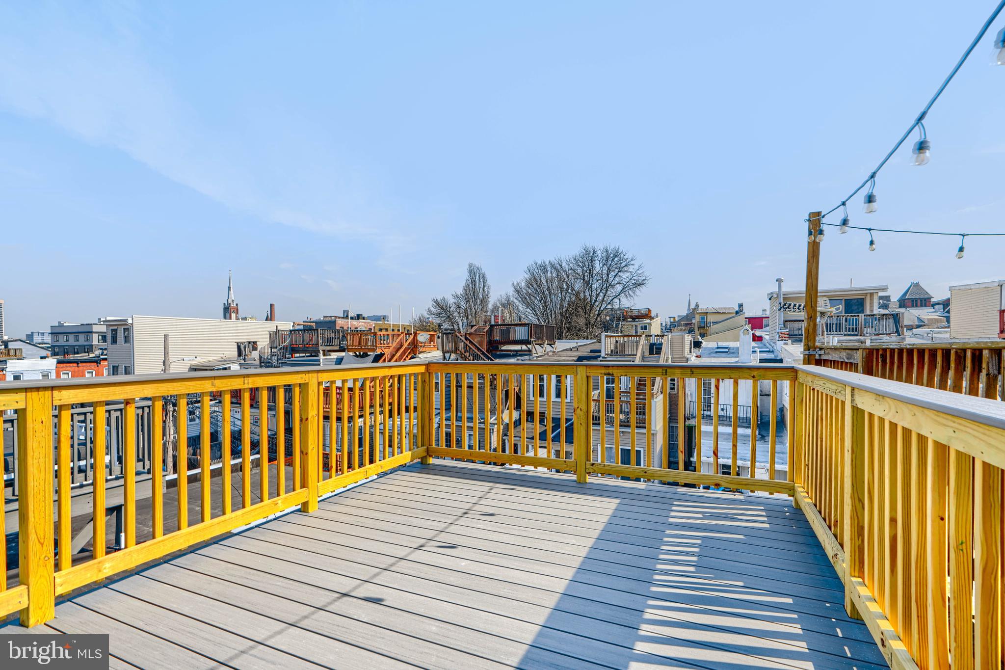 1427 Patapsco Street Baltimore, MD 21230 - Photo 31 of 34 a view of balcony with wooden floor and fence
