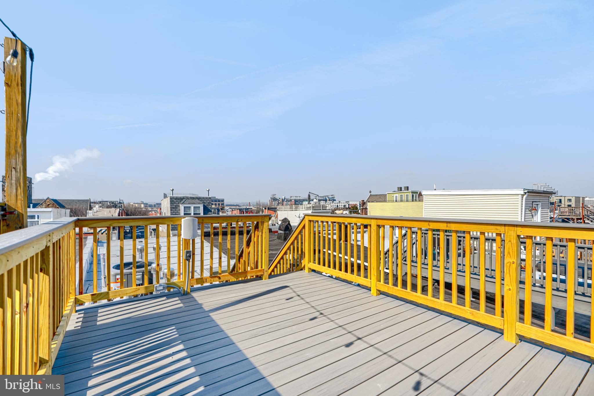 1427 Patapsco Street Baltimore, MD 21230 - Photo 32 of 34 a view of wooden balcony with outdoor seating