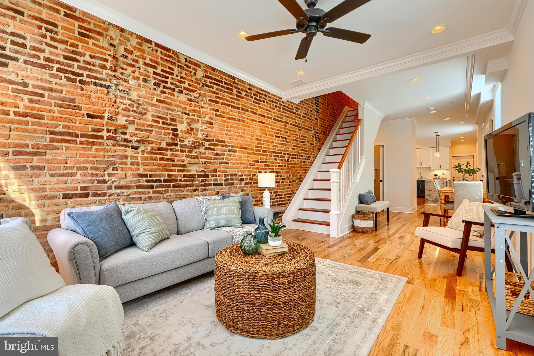 1427 Patapsco Street Baltimore, MD 21230 - Photo 4 of 20 a living room with furniture and a wooden floor