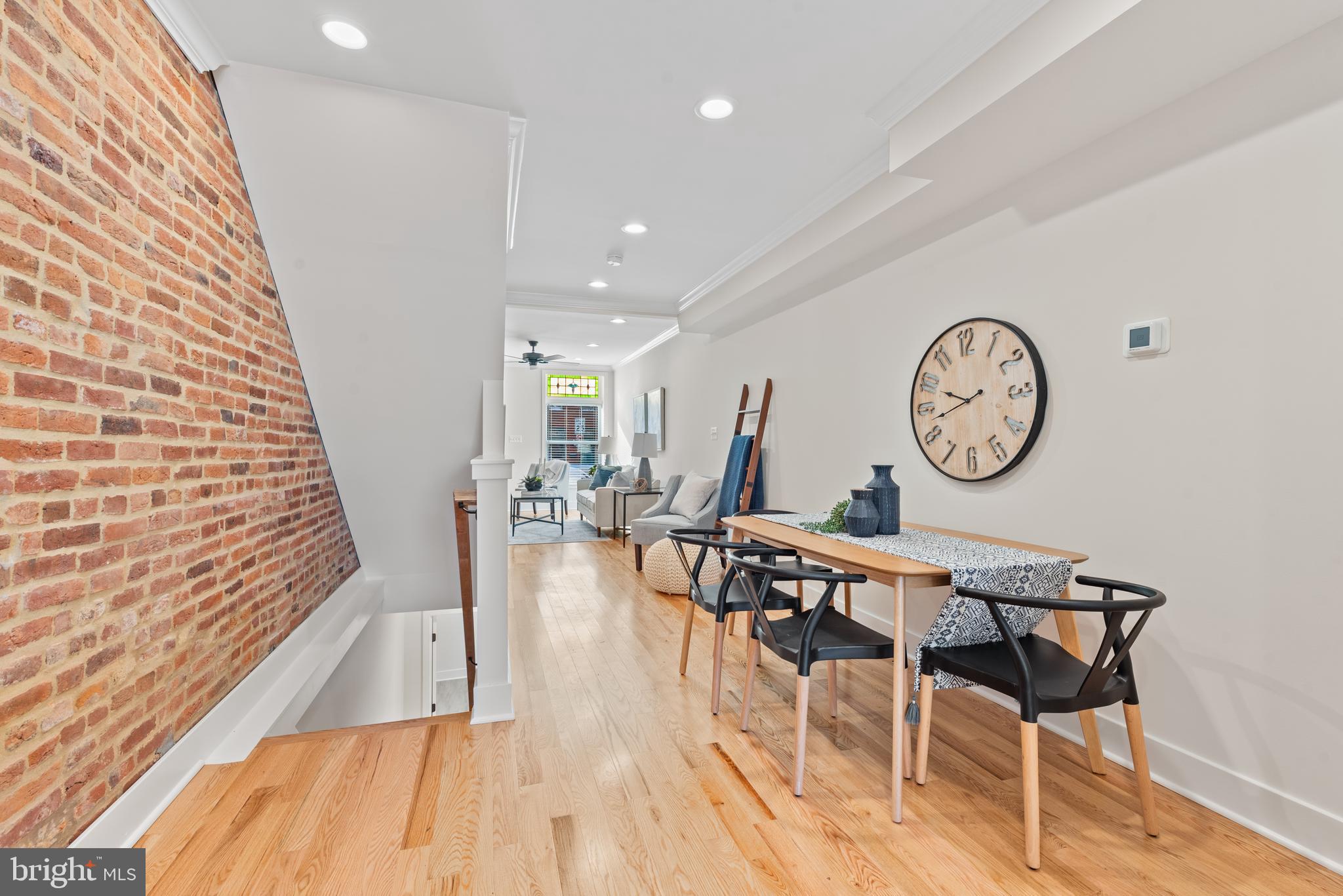 1427 Patapsco Street Baltimore, MD 21230 - Photo 6 of 20 a view of a room with a table and a clock