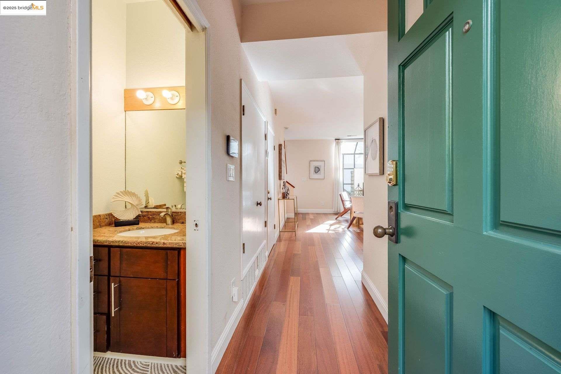 2316 Blake Street, Unit D Berkeley, CA 94704 - Photo 1 of 31 Foyer entrance with dark wood-style floors and baseboards