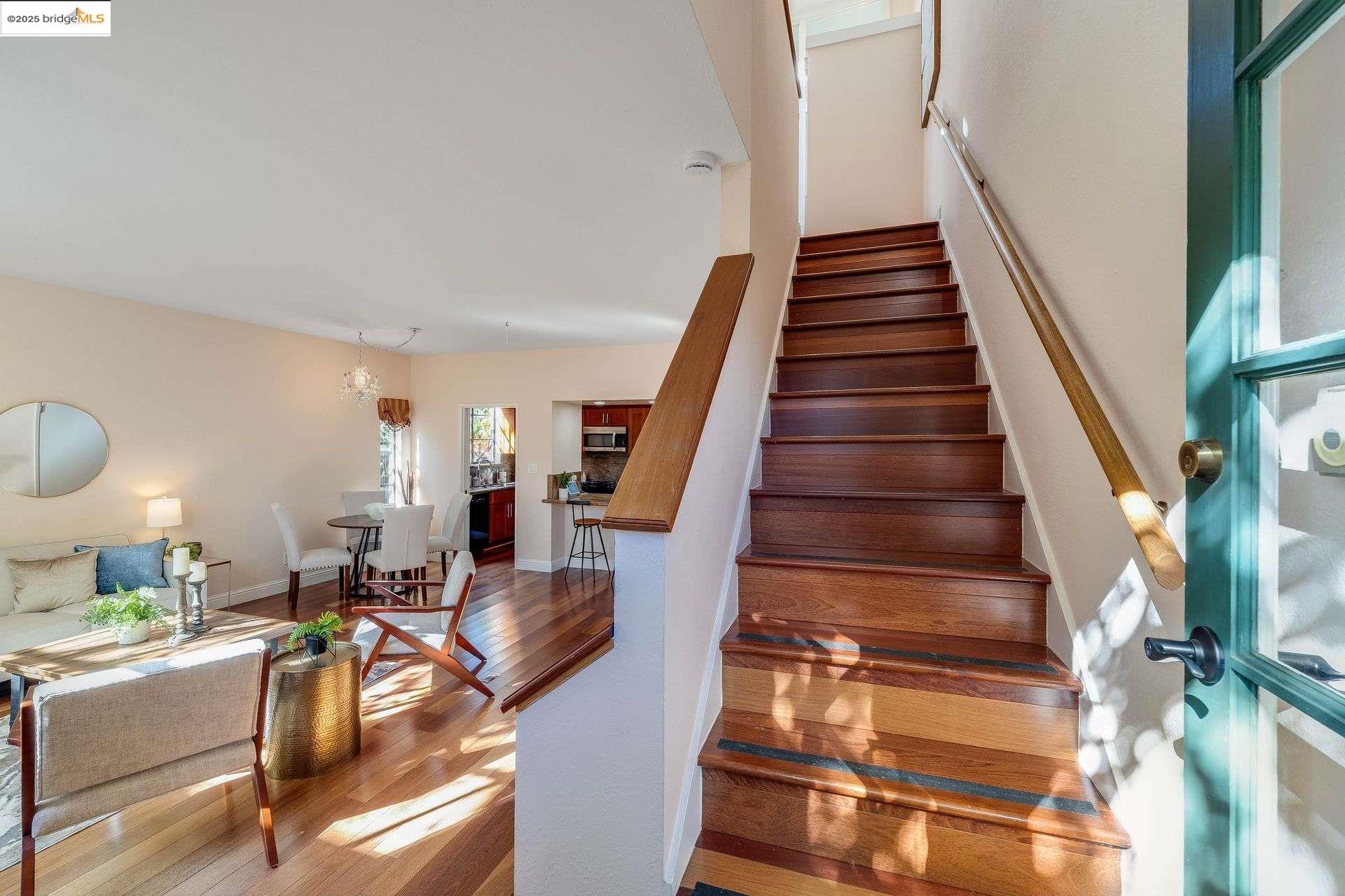 2316 Blake Street, Unit D Berkeley, CA 94704 - Photo 21 of 31 Stairs with wood finished floors and baseboards