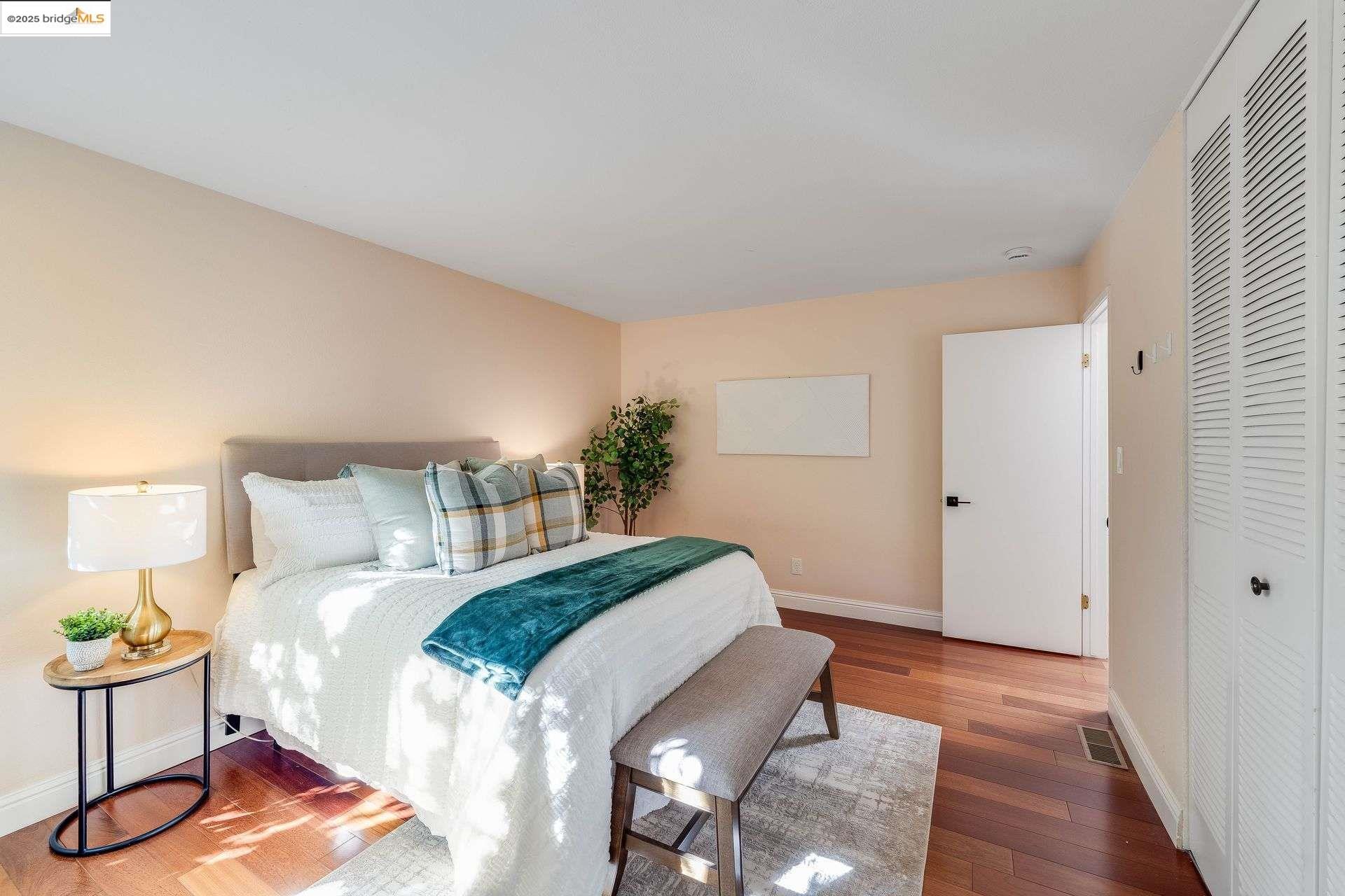 2316 Blake Street, Unit D Berkeley, CA 94704 - Photo 26 of 31 Bedroom featuring wood-type flooring and a closet