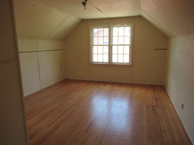 505 South Prospect Avenue Champaign, IL 61820 - Photo 14 of 19 an empty room with wooden floor and windows