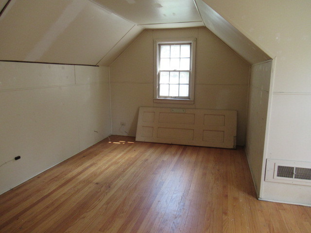 505 South Prospect Avenue Champaign, IL 61820 - Photo 15 of 19 an empty room with wooden floor and windows