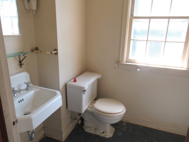 505 South Prospect Avenue Champaign, IL 61820 - Photo 16 of 19 a white toilet sitting next to a bathroom sink