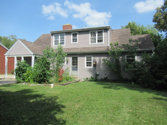 505 South Prospect Avenue Champaign, IL 61820 - Photo 3 of 19 a front view of a house with a yard and garage