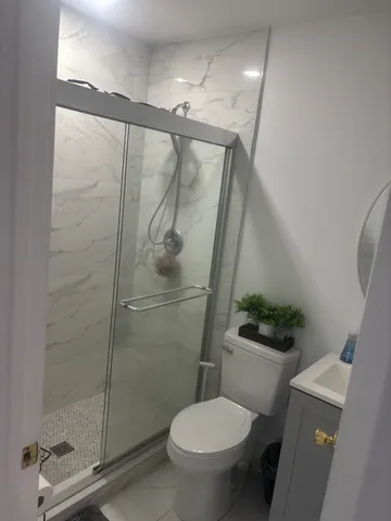 a front view of a house with a yard and a garage