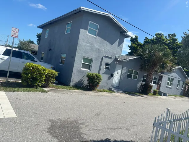 a kitchen with stainless steel appliances granite countertop a sink and a stove
