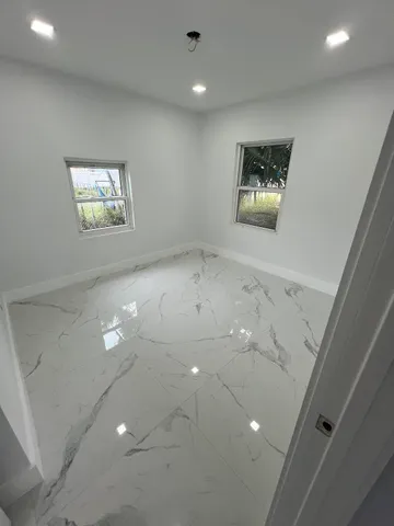 a bathroom with a shower and a toilet