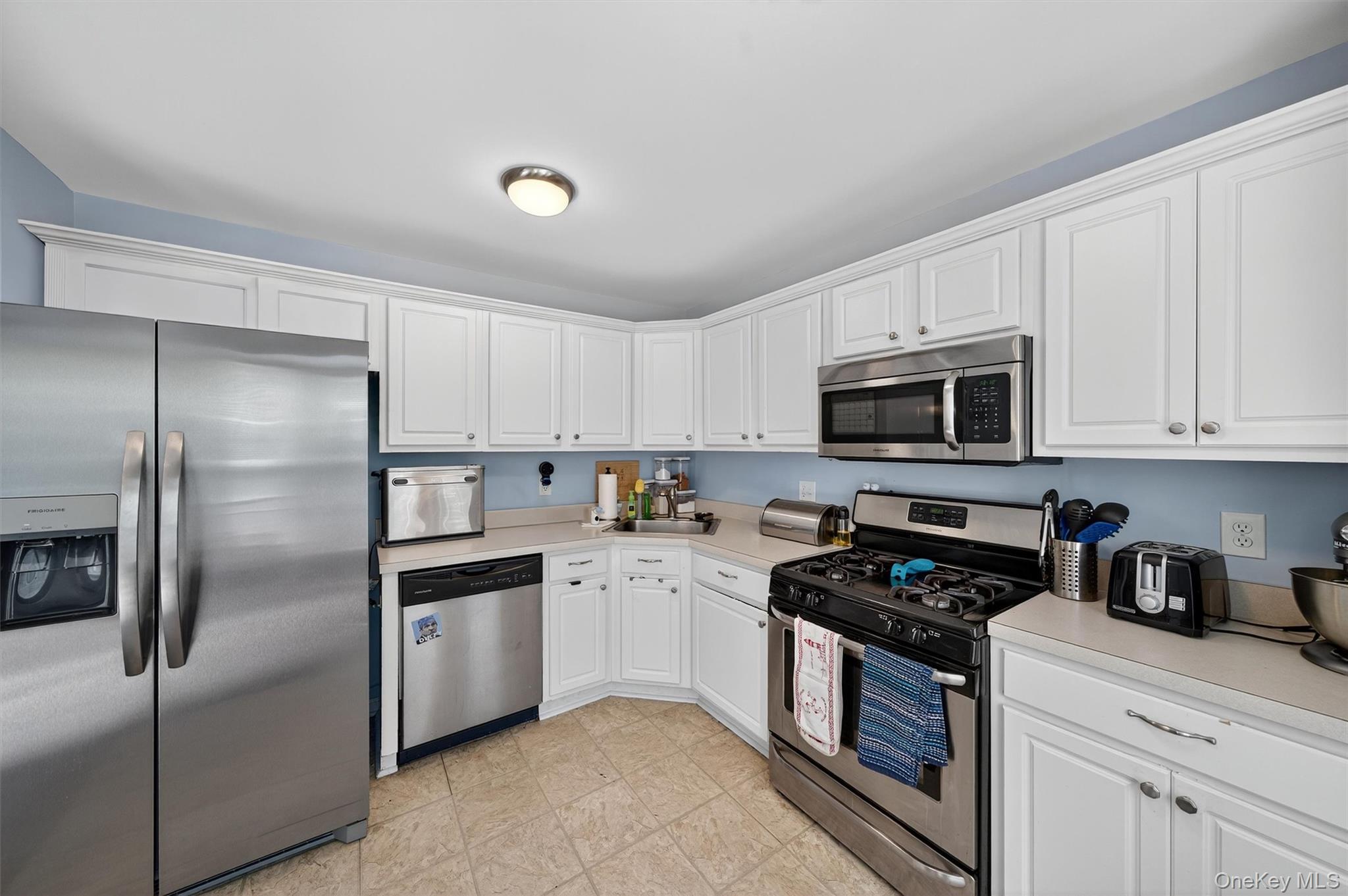 1 Lake Ridge Drive Middletown, NY 10940 - Photo 15 of 44 a kitchen with cabinets stainless steel appliances and a counter space