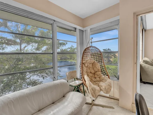 a living room with a couch and a window