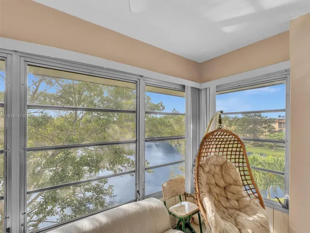 a view of a living room with a large window