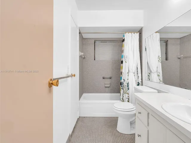 a bathroom with a sink a toilet and a bathtub