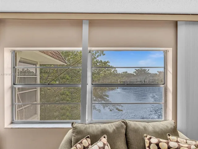 a living room with a couch and a window