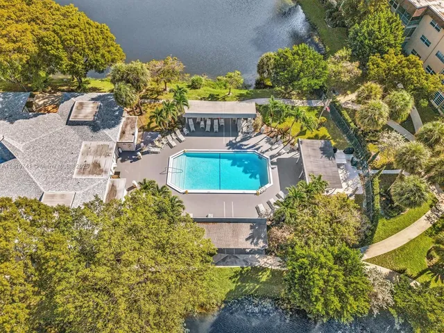 aerial view of a house with a yard and a garden