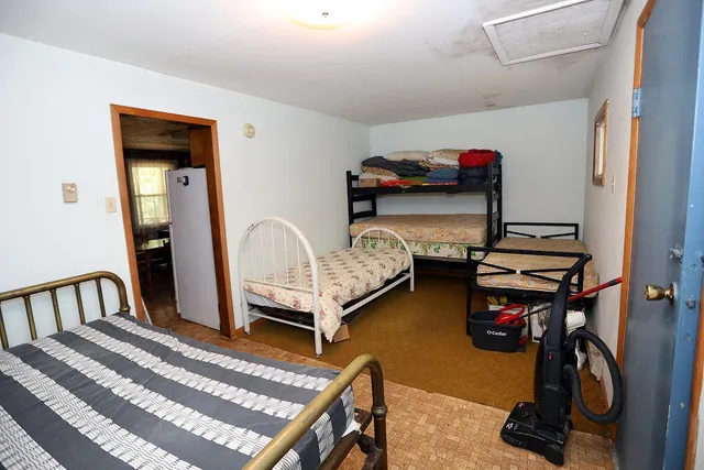 a bedroom with bed and a window