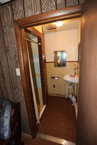 a bathroom with a sink and a mirror