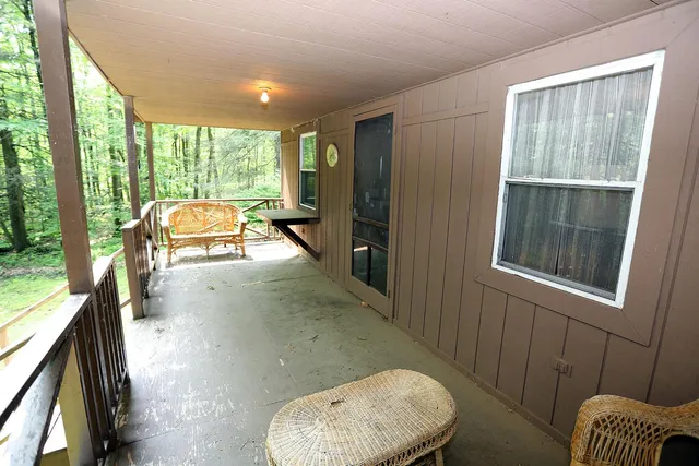 a view of balcony with furniture