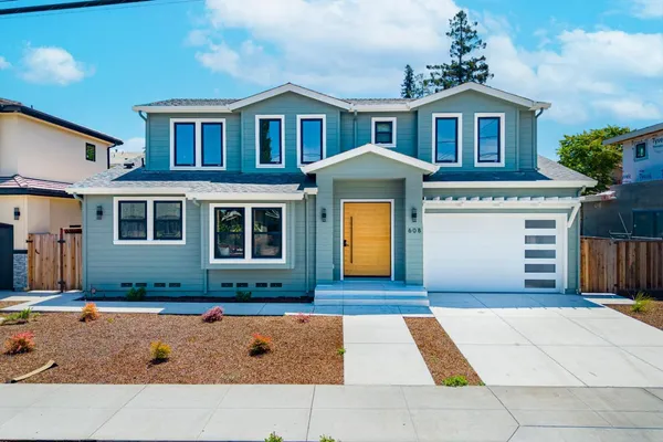 a front view of a house with a yard