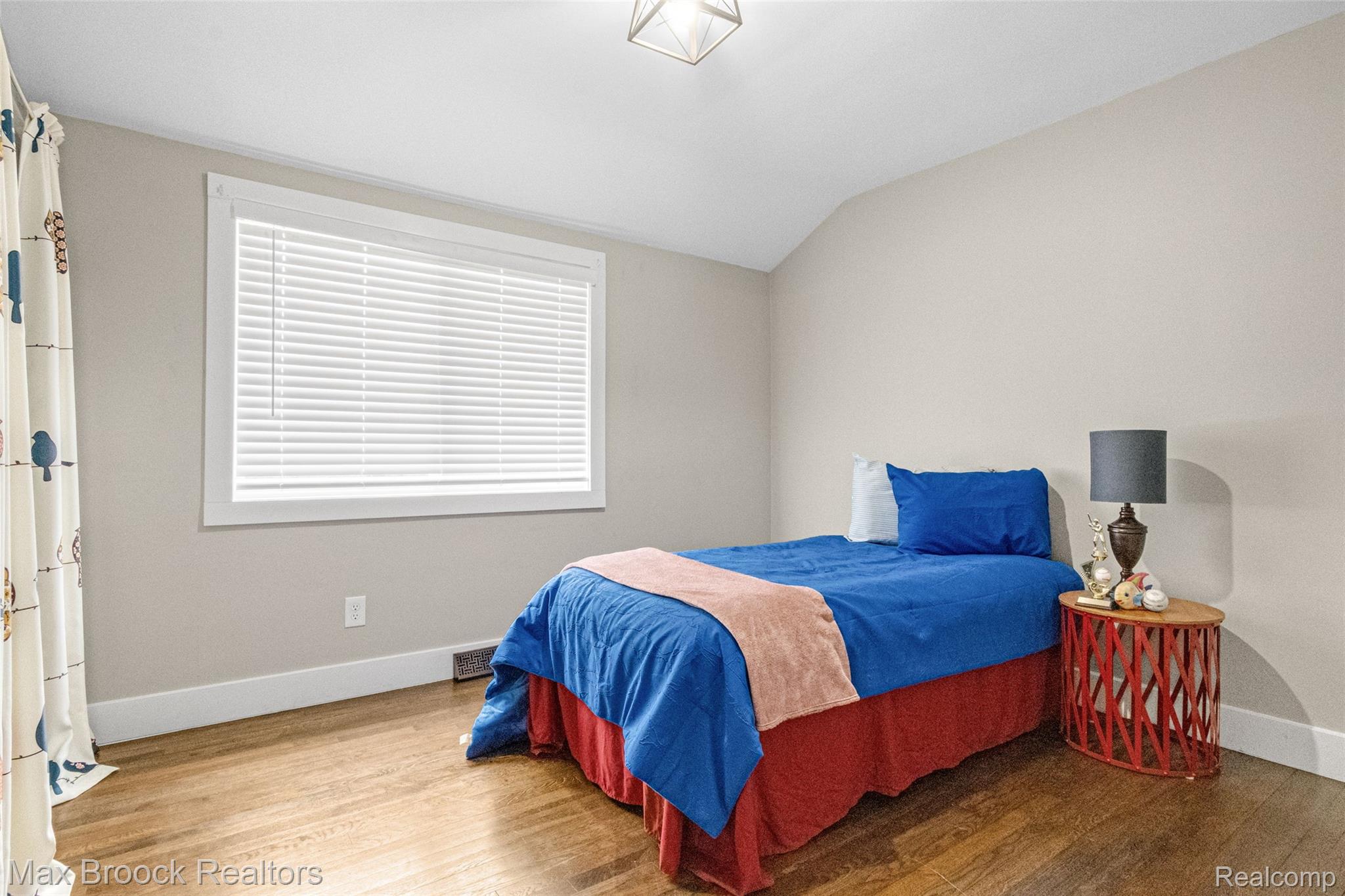 2905 Lahser Road Bloomfield Hills, MI 48304 - Photo 22 of 28 Room featuring wood-finish flooring, neutral wall paint, and white trim