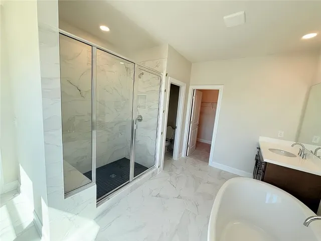 a bathroom with a sink a toilet and a tub