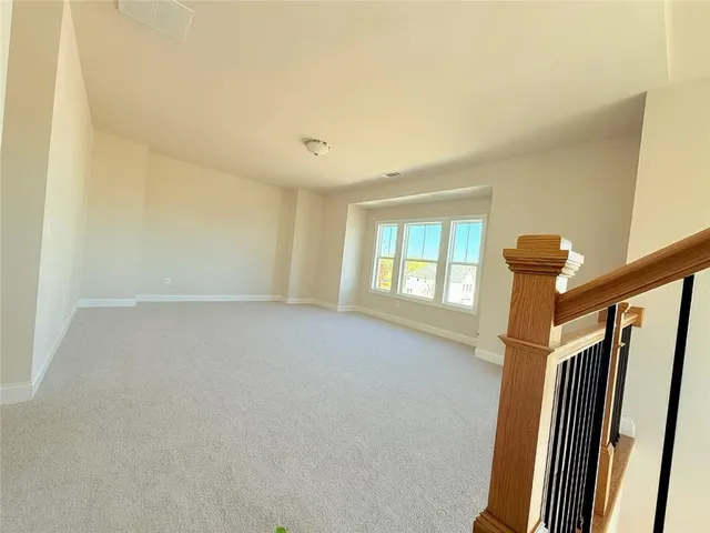a bathroom with a tub sink and window