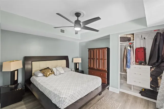 a bedroom with a large bed and a window