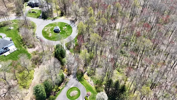 aerial view of a golf course with swimming pool