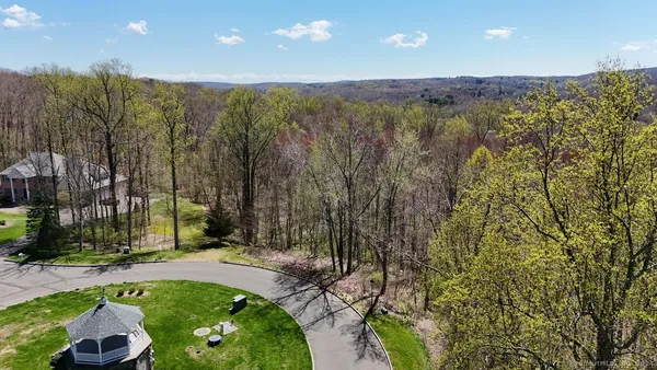 an aerial view of a house with outdoor space