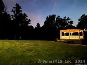 a view of a big yard with an outdoor space