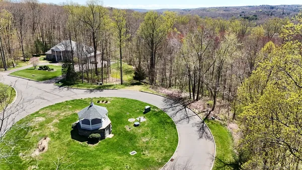 a aerial view of a house with a yard