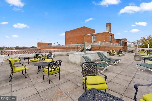 a swimming pool with outdoor seating and yard