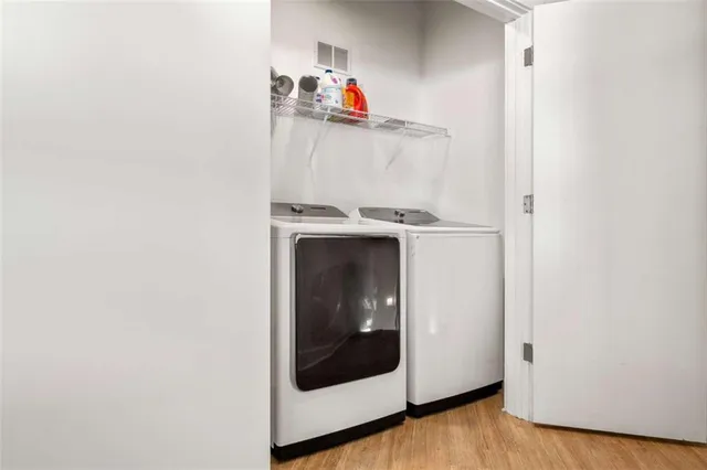a bathroom with double vanity sink and a mirror
