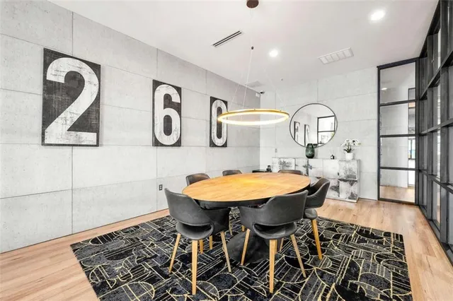 a living room with a couch and a chandelier