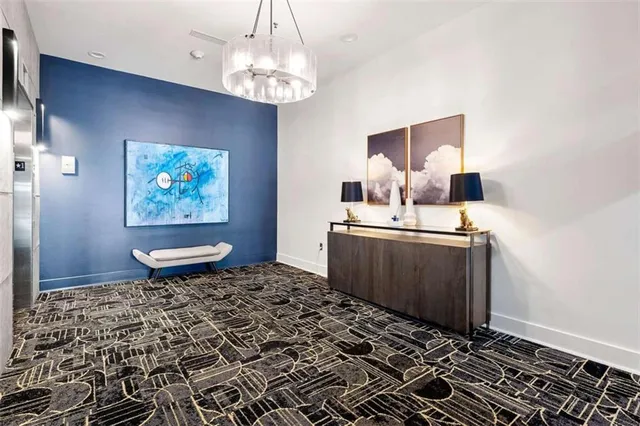 a living room with furniture a tree and a rug