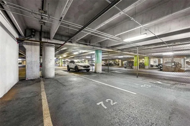 a view of a room with a window and a shower curtain