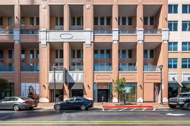 a view of a street that has couple of cars parked on the road