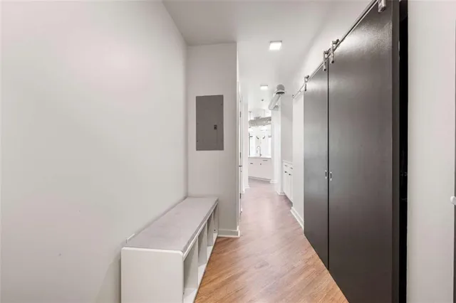 a white bath tub sitting next to a shower