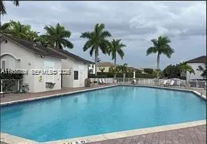 a view of a swimming pool and lounge chair