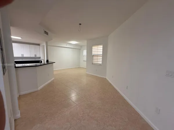 a view of a kitchen with a sink