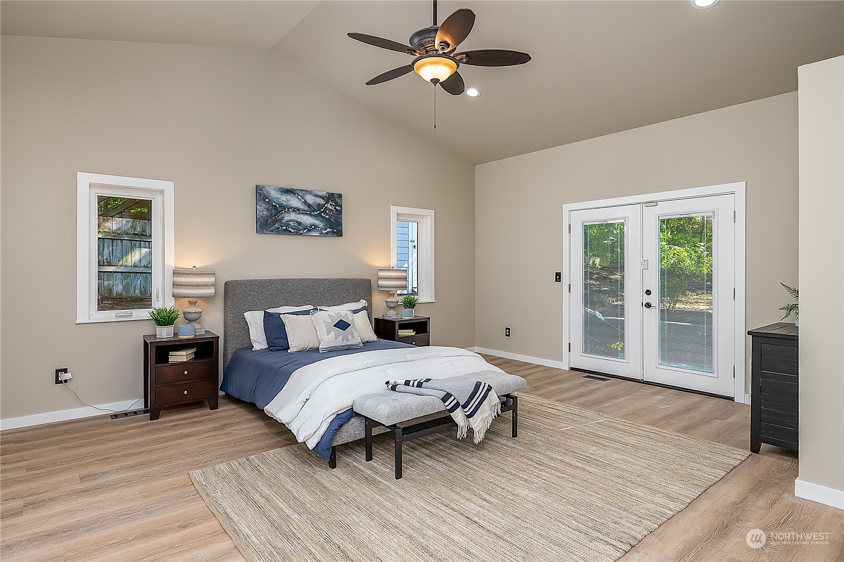 24121 6th Place West Bothell, WA 98021 - Photo 12 of 32 a bedroom with a bed and wooden floor