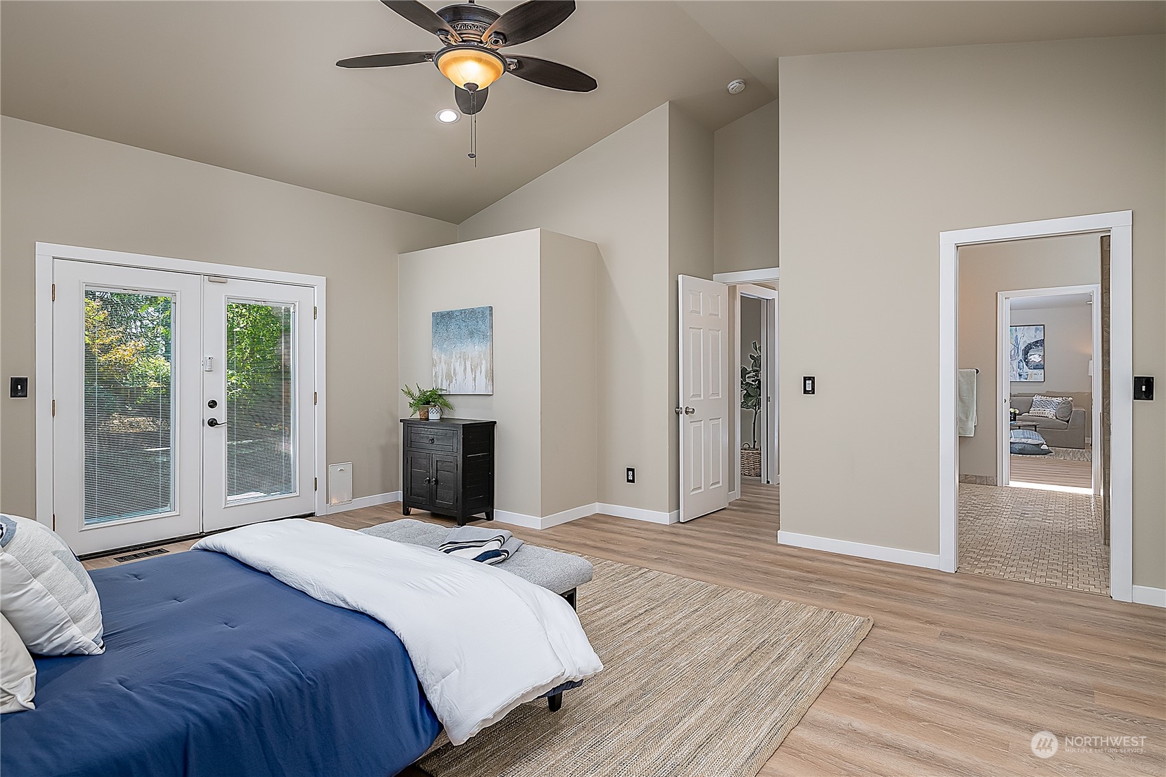 24121 6th Place West Bothell, WA 98021 - Photo 14 of 32 a bedroom with a bed and a chandelier