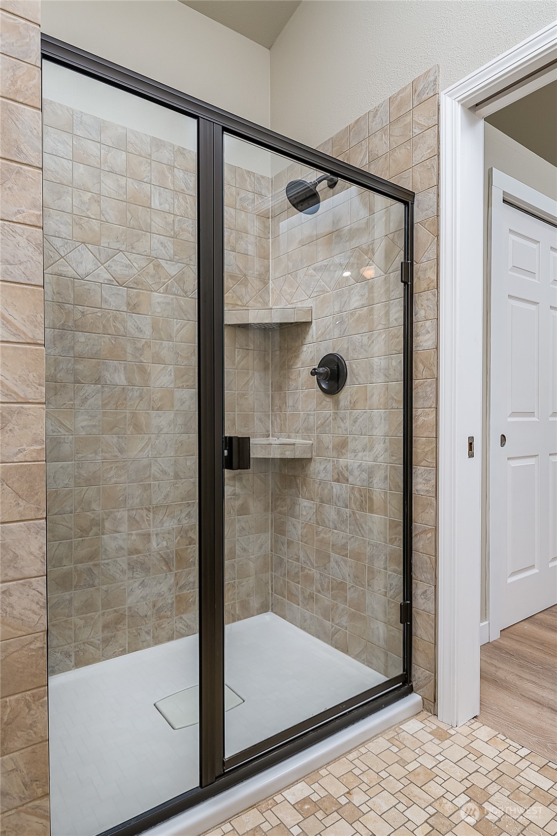 24121 6th Place West Bothell, WA 98021 - Photo 17 of 32 a bathroom with a glass shower door