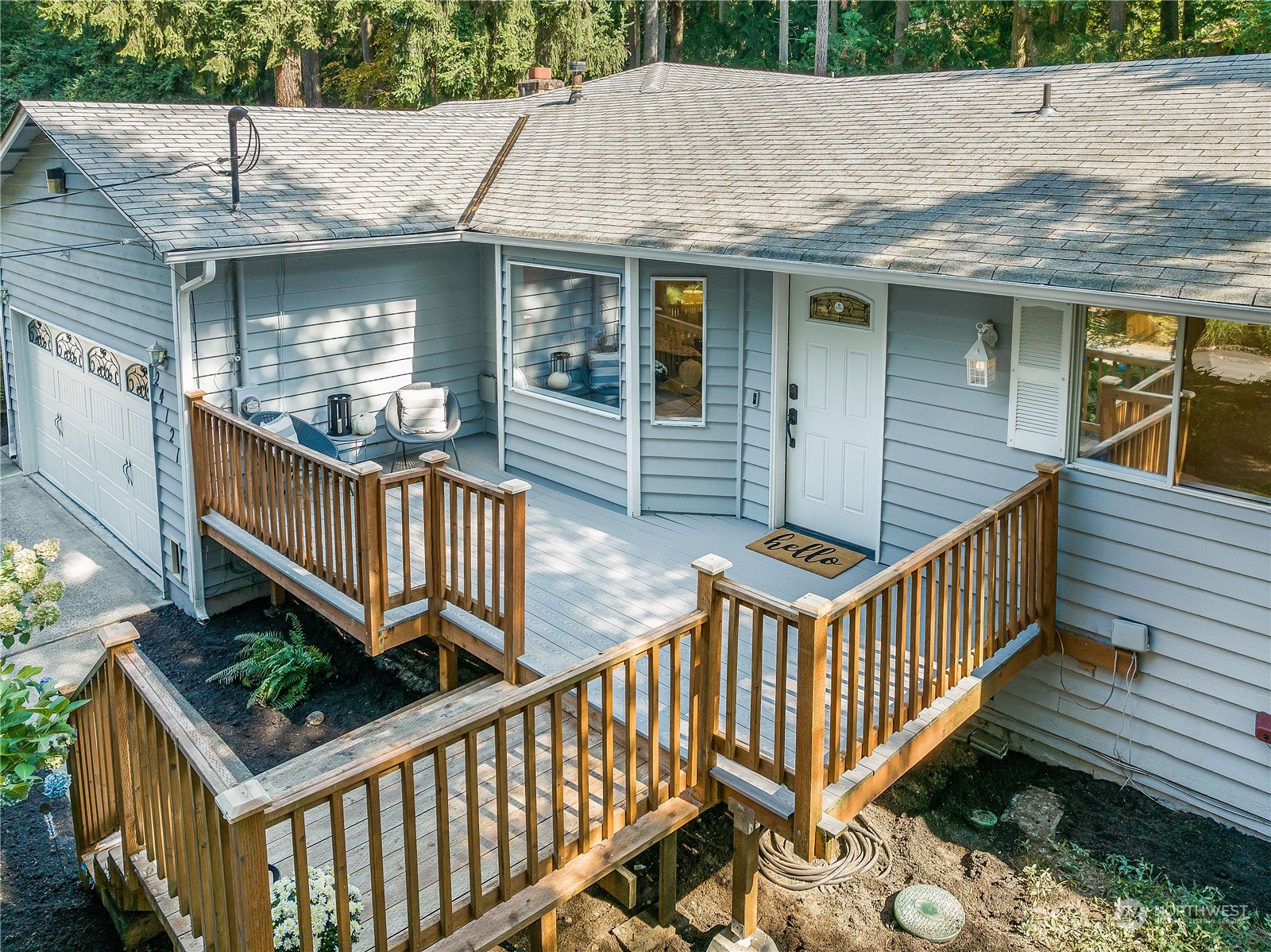 24121 6th Place West Bothell, WA 98021 - Photo 2 of 32 a view of a house with wooden deck and furniture