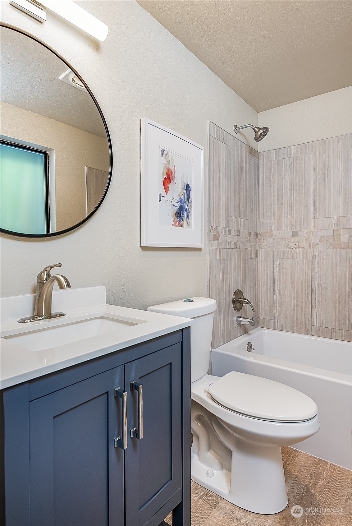 24121 6th Place West Bothell, WA 98021 - Photo 21 of 32 a bathroom with a sink a toilet and a mirror